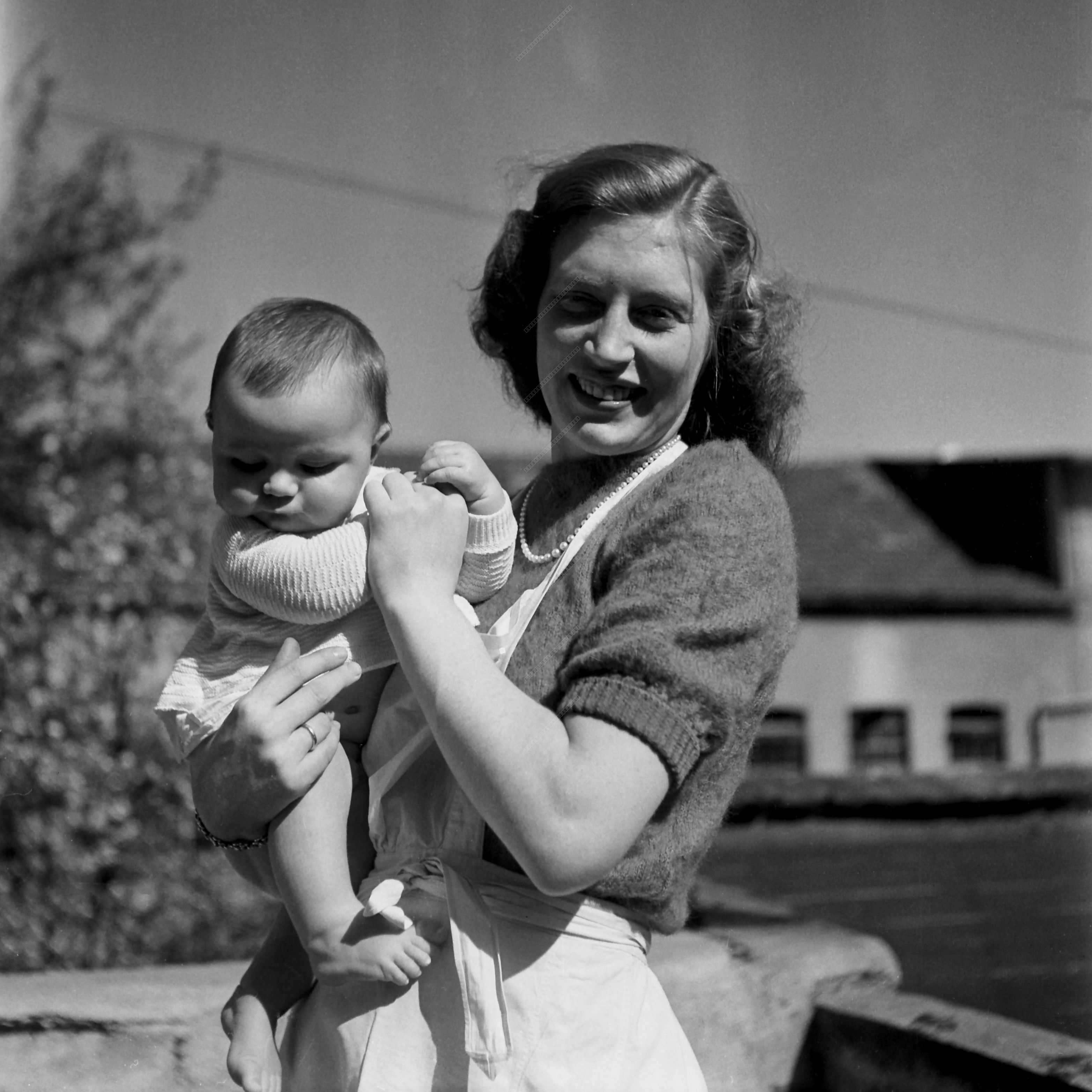Mother with Baby Outdoors in Munich (Post-War Period)